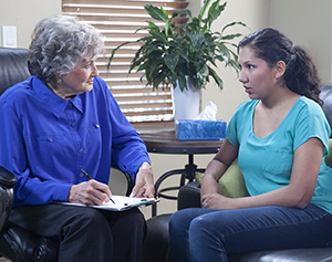 Woman talking to therapist.